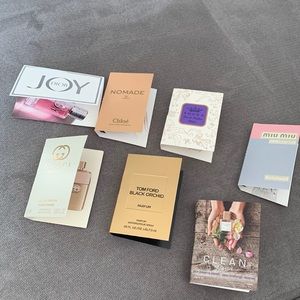 Lot of 7 trial size perfumes. See photos for brands. All brand new.